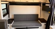 Murphy bed in folded position with couch