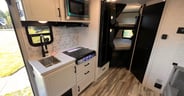 Small kitchen features optional oven and square sink