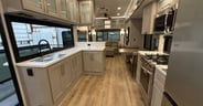 A long counter top that faces the outdoor living space in the Al