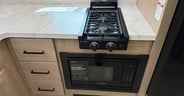 A smaller two-burner stove but convection air fryer microwave