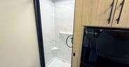 Nautilus shower door in the Grand Design Imagine AIM 15RBA