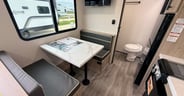 A dinette offers seating and sleeping options in the Imagine AIM