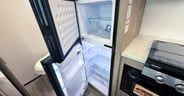 A smaller 12 volt fridge in the Grand Design Imagine AIM 15RB