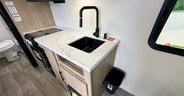 A trash can mounted to a metal bracket offers convenience but ma