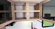 Overhead cabinets in the kitchen of the Grand Design Imagine AIM