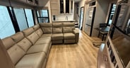 A large L-shaped sofa offers recliners in the outboard seating positions.