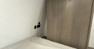 Bedside cubbies feature household and USB power outlets
