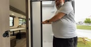 Nautilus-style shower door in the Grand Design Transcend 325BHT