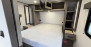 Storage in the main bedroom of the Grand Design Transcend 325BHT