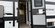 The bathroom has a separate entrance in the Grand Design Transce