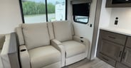Theater seats are a comfy place with power-operated reclining fu