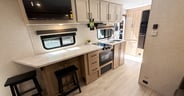 An enormous counter top and dining space in the Ember RV E-Serie