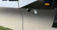A convenient sewer hose carrier with a light above it for those