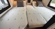 A folding insert converts the two twin beds to a king in the Gra