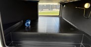A large pass-through storage bay in the Grand Design Reflection