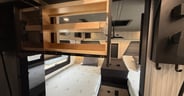A pull-out drawer for spices or cans adds to the kitchen storage