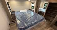 A queen-size bed is standard with an optional king in the Reflec