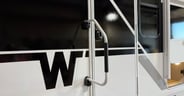 A second bedroom entry door without a window in the Winnebago Th