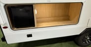 Additional outside storage plus a mini fridge in the Thrive 22MB