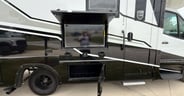 An outside TV plus basement storage in the Grand Design Lineage