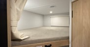 Each of the bunks has a light and roller shades plus 250 pound c