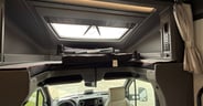 Over-cockpit sleeping area in the Grand Design Lineage Series M