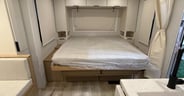 The Murphy bed deploys easily and offers a 66 x 80 bed