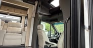 The cockpit and overhead bunk in the Grand Design Lineage Series