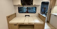 The dinette easily makes into a bed for 1-2 adults