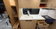 Two trash cans plus pantry drawers and the ability for the stora