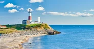 Montauk Lighthouse and beach, Long Island, New York, USA.