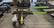 An RV chassis with tank supports welded to support holding tanks