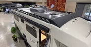 Roof brush guards conceal the two solar panels and other roof-top components