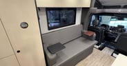 A little table slots into the armrest on either side